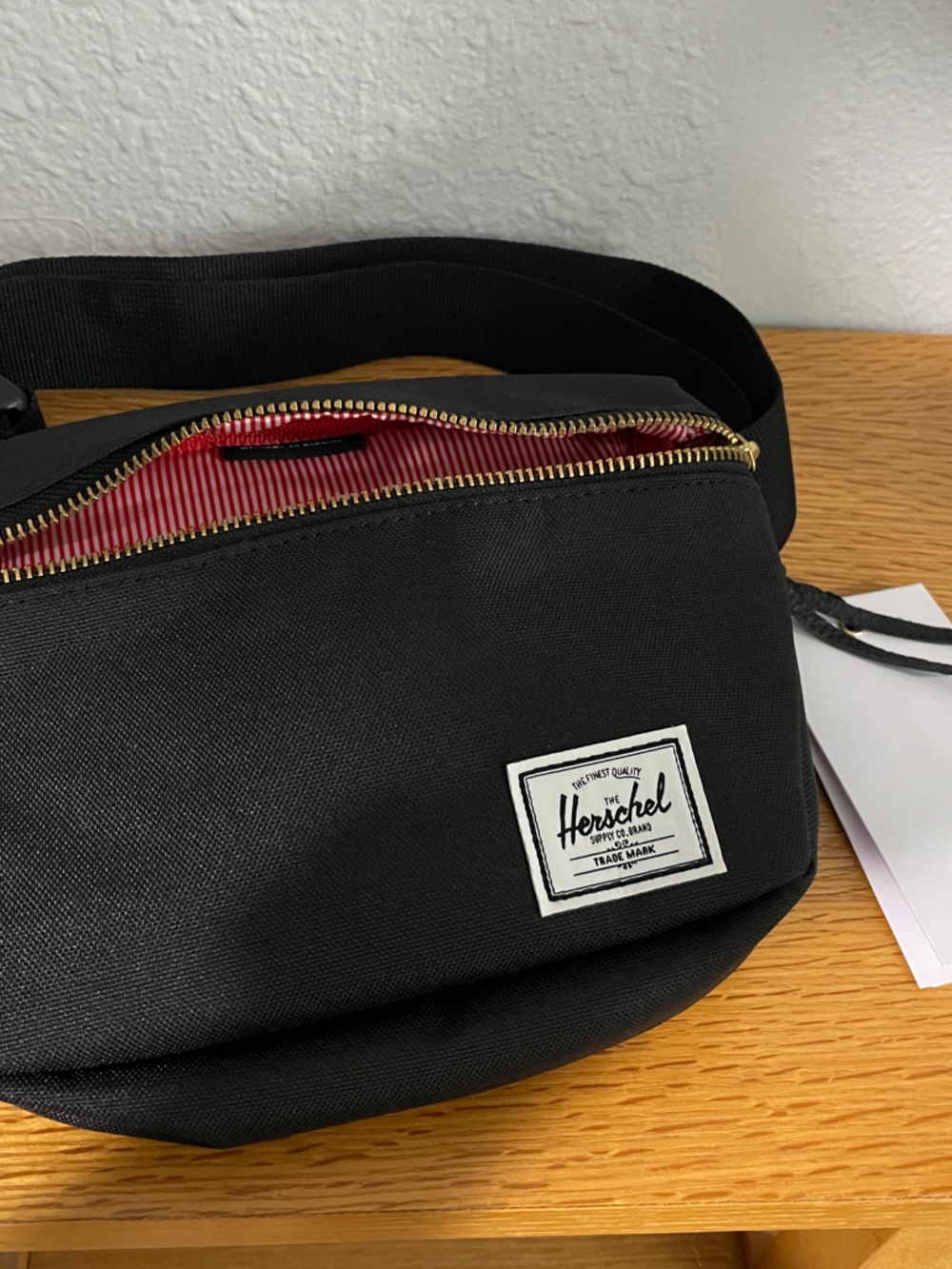 Herschel Supply Co. Black Crossbody Waist Bag with Red Stripe Lining